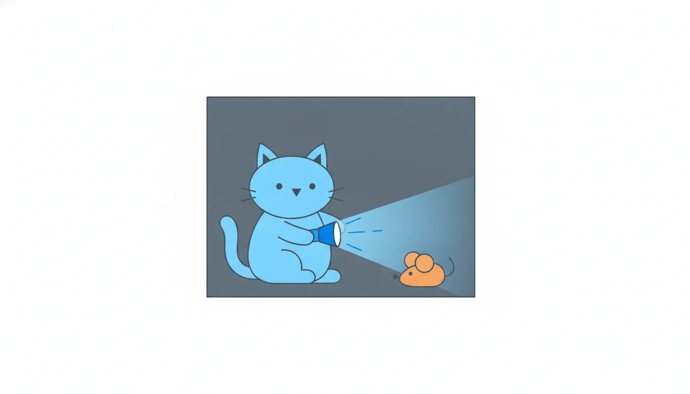 In a dark room a cat shines a small, weak flashlight, and its narrow beam misses an orange toy mouse sitting just outside the light.